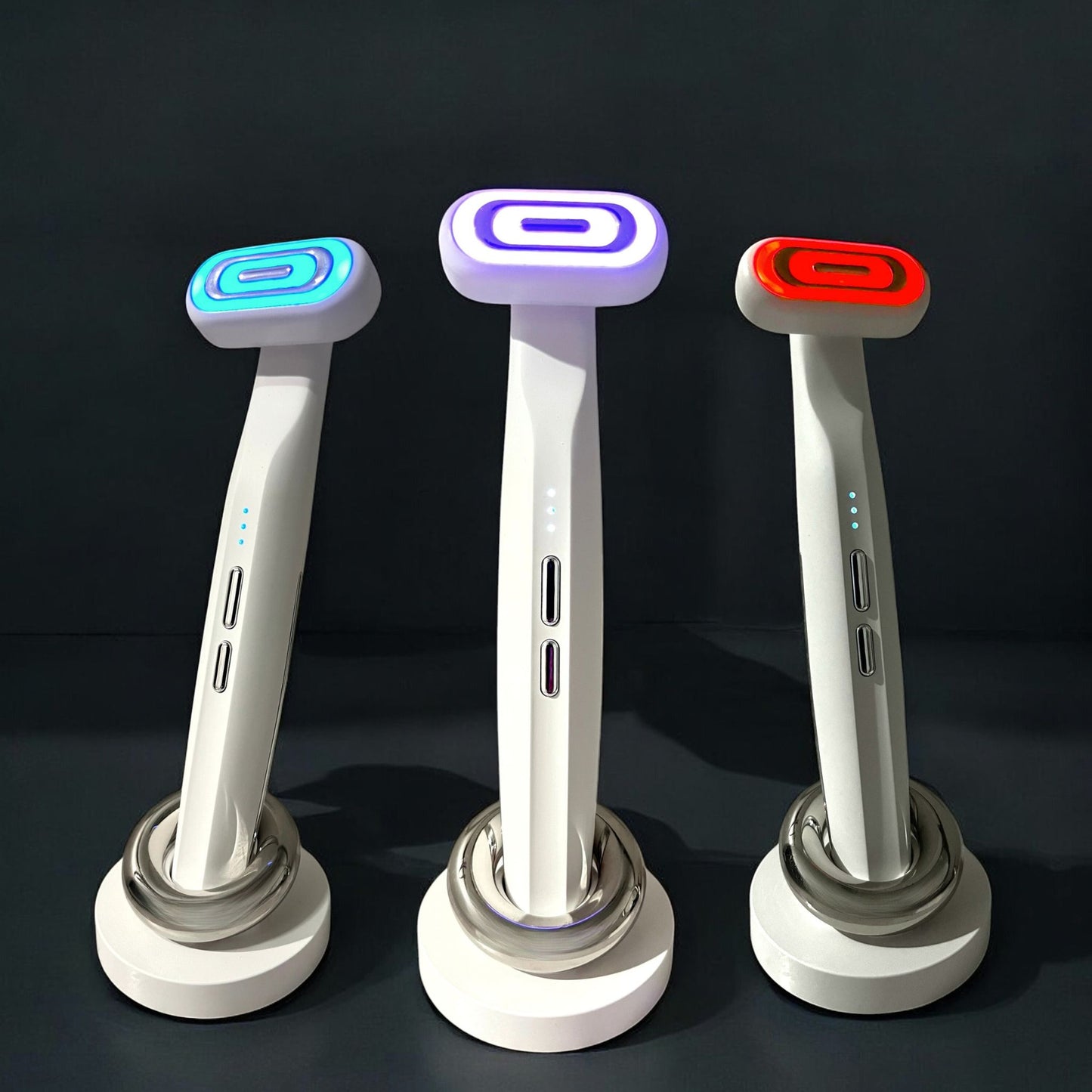 Light therapy wand massager for the face, showing its blue, purple, and red light modes.