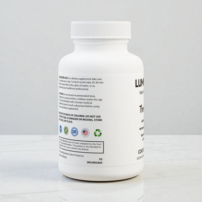 Co Enzyme Q10 skincare supplement, left side, standing on a modern marble table, showing product certifications like GMP, Lab-tested, and Made in USA.