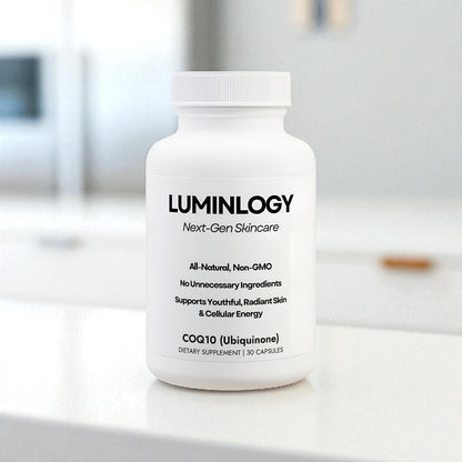Luminology all natural, non-gmo CoQ10 supplement bottle on a kitchen table with a blurred background.