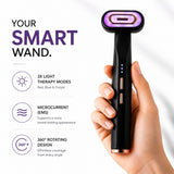 A hand holding a smart purple light therapy face wand with the specs and modes.