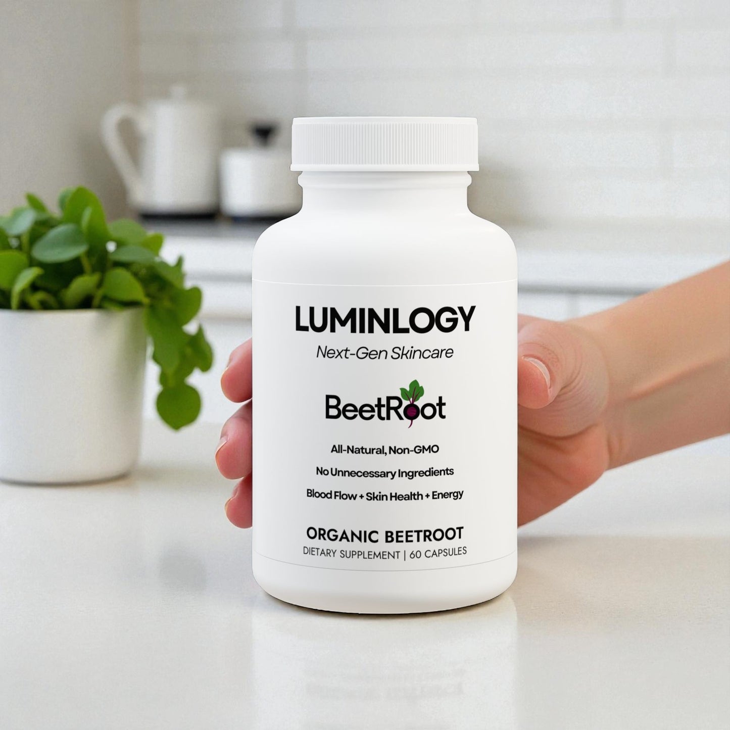 A person holding the Luminlogy Beetroot supplement bottle on a kitchen counter.