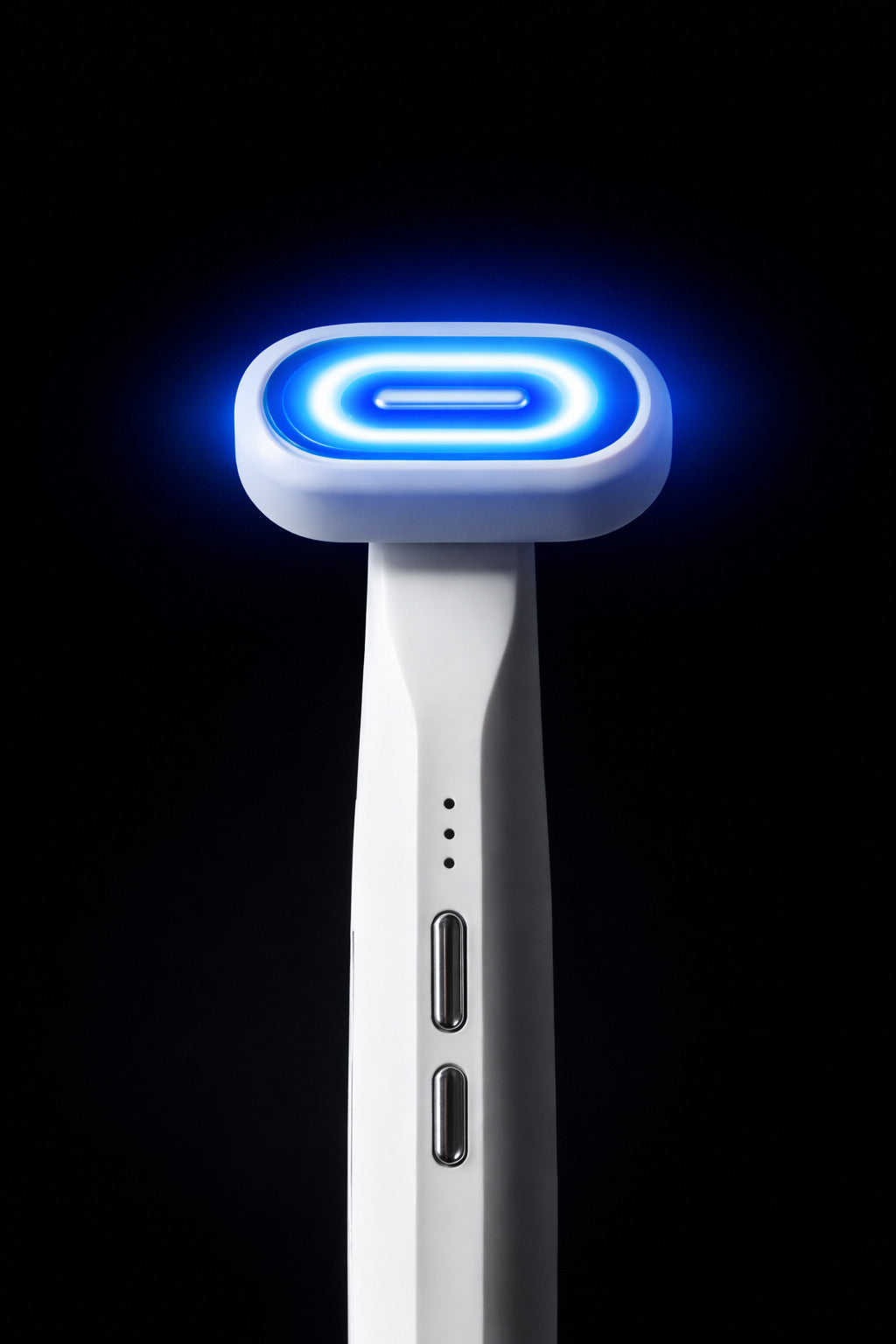 Blue light therapy face wand with a black background. 