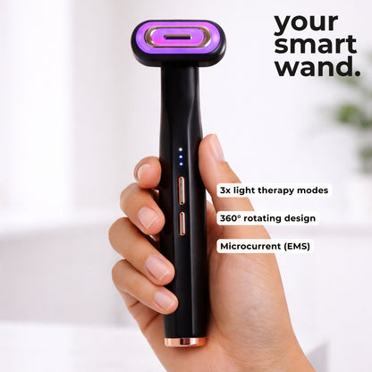 A hand holding a smart red light therapy face wand with the specs and modes.